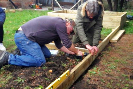 service users at drug and alcohol rehabilitation centres build raised beds for growing